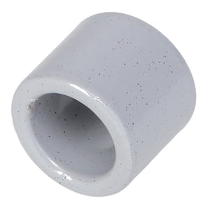 Close-up of the AGCO | SPACER TUBE - AG109812, a white cylindrical ceramic piece with an open center and speckled surface. No current product description information is available.