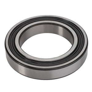 A close-up of the AGCO Bearing - La24905360, featuring a circular, donut-like shape with precisely grooved inner and outer rings.