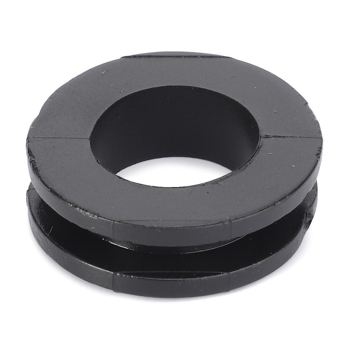 A black, round rubber Cable Bushing - X665231000000 from AGCO, featuring a central hole and a groove around its circumference.