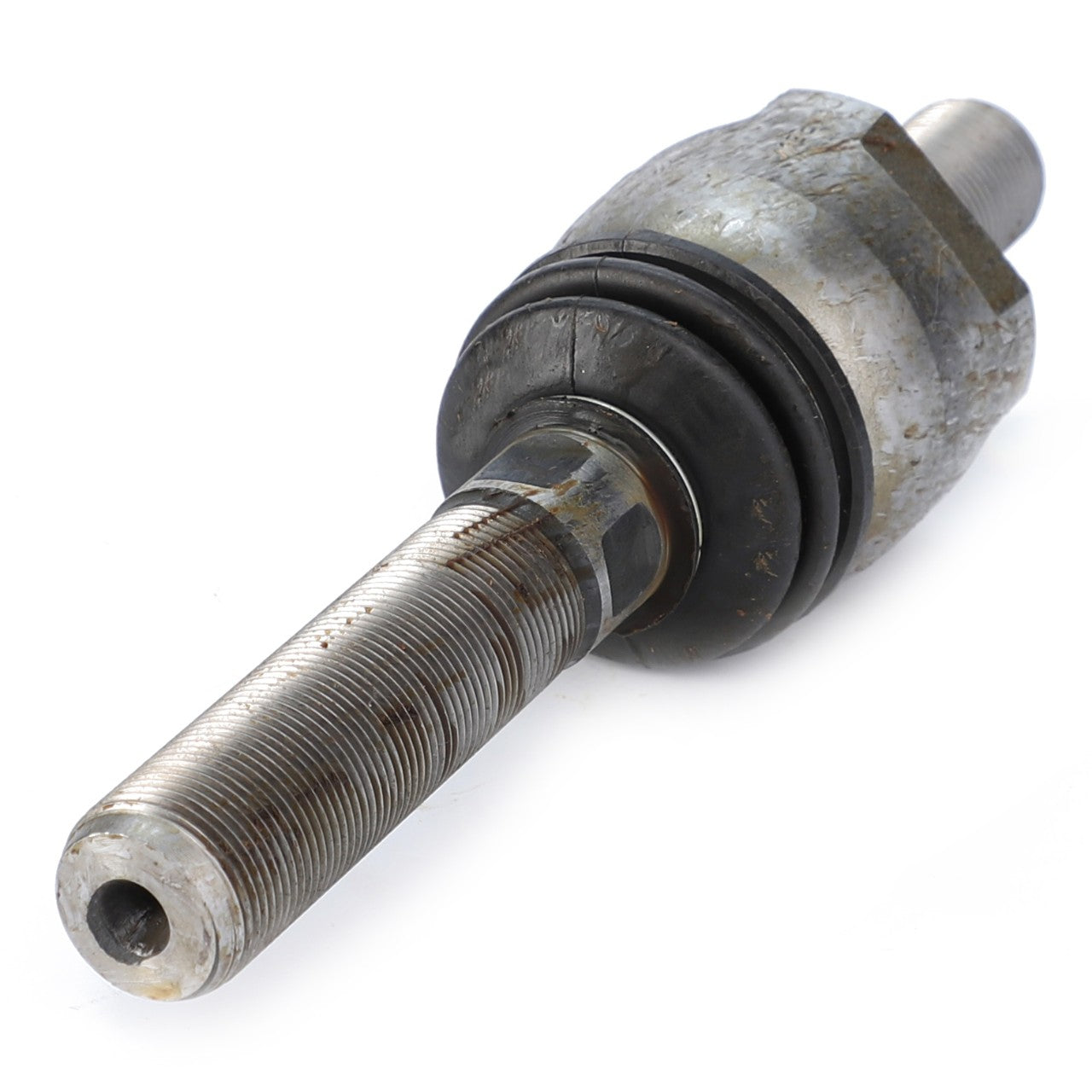 Close-up of a metal automotive part with a threaded shaft and a cylindrical end, partially covered in grease and grime. This AGCO Genuine Ball Joint - F339300020290 component is crafted from high-grade steel, ensuring durability and reliable performance.