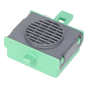 A small AGCO | Buzzer - 700705642 with a rectangular plastic design, green and gray exterior, featuring a grid-like circular vent on top and small tabs on its sides, often found in Fendt Models.