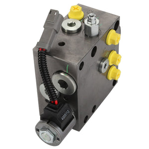 Current product description: The AGCO Brake Valve - Acw2946290 is a square metal hydraulic valve block featuring multiple ports, yellow caps, and an attached gray connector with a black and red wire.