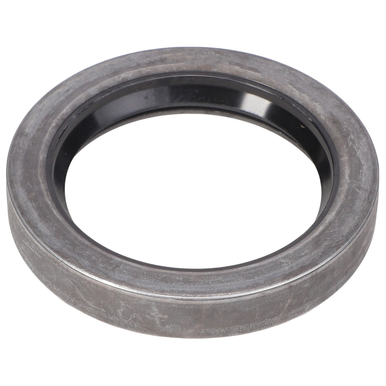 The AGCO SEAL - E1443 is a round, gray metal ring with a black inner lining, often used as a mechanical seal or bearing in machinery.