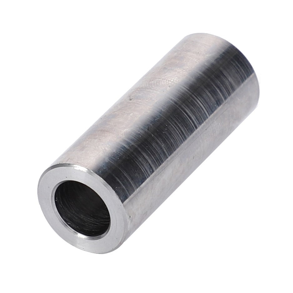 A cylindrical metal spacer with a hollow center, featuring a shiny, polished finish that evokes the precision of AGCO machinery, specifically the AGCO Distance Bushing - F946201100060.