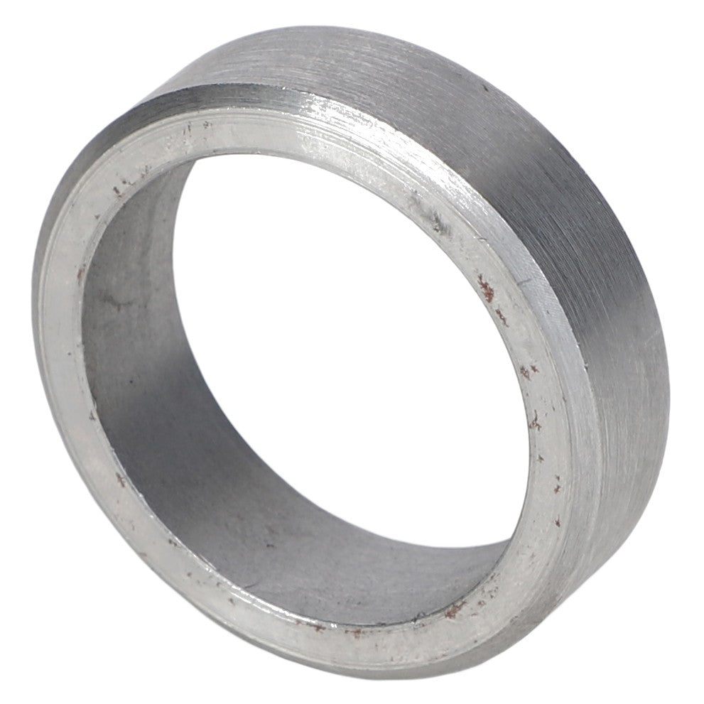 A close-up view of the AGCO Bush - Acp0012070 reveals a metallic bushing with a smooth surface, cylindrical shape, and encircled by a slight edge, ensuring precision. Brand: AGCO.