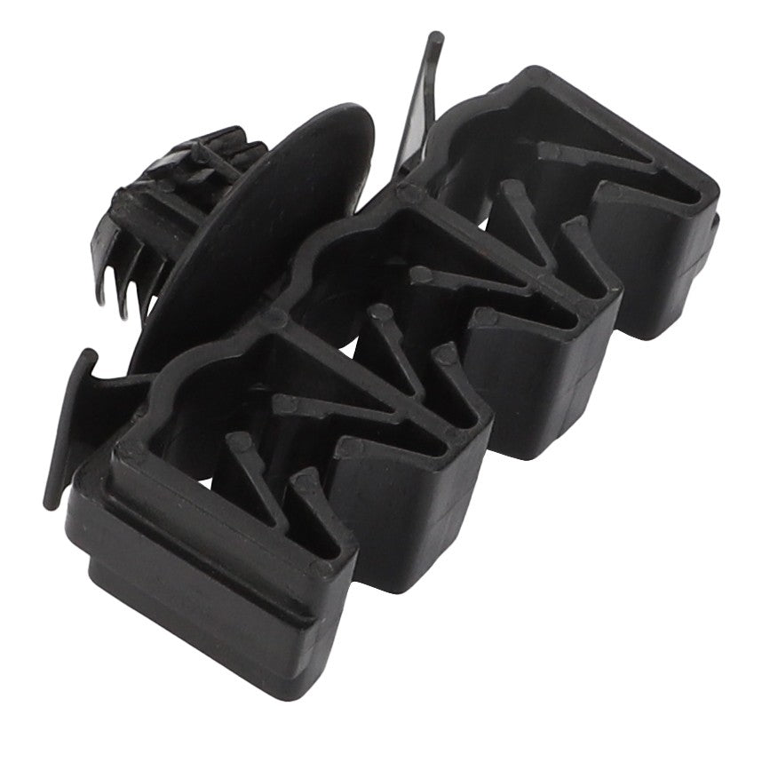 Close-up of the AGCO | Clamp - Acp0670660, a black plastic automotive fastener featuring multiple clips and a push-in pin design. No current product description available.