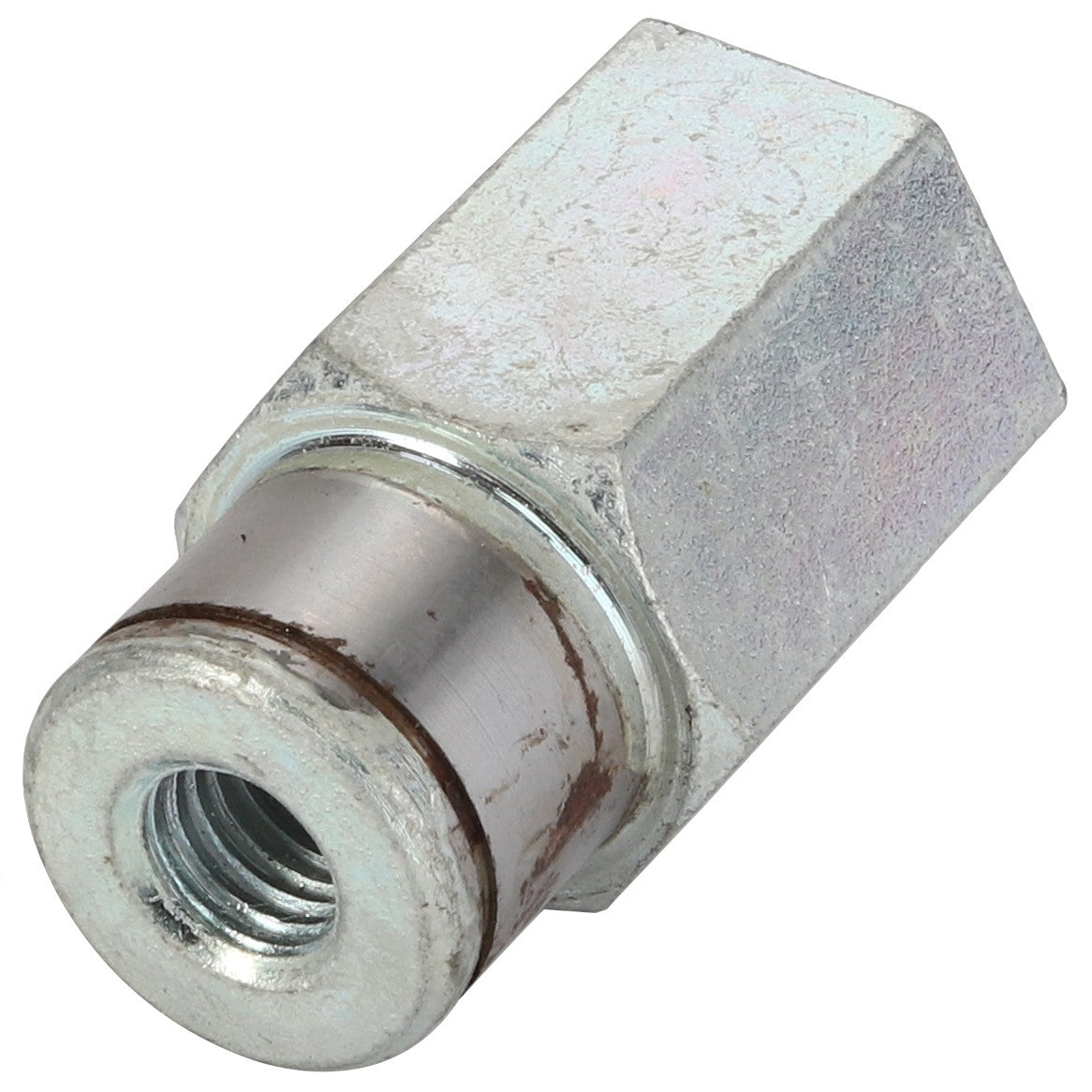 A metallic hexagonal coupling nut with a threaded hole and a worn cylindrical end, lying on a white background. No current product description information is available for the AGCO Pin - La322041250.