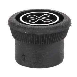 The AGCO | BUTTON - D45070026 is a black plastic bottle cap with a distinctive white flower-like imprint on the top surface, showcasing its unique design element.