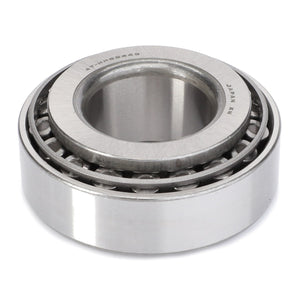 Image of the AGCO Taper Roller Bearing - F334310020060 featuring outer and inner rings, with cylindrical rolling elements arranged in a single row. Made of metallic material and designed to handle high radial loads, the bearing also has clearly visible markings.