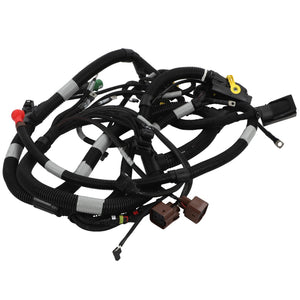 A coiled bundle of AGCO | Harness - Acw1022530 black automotive wiring harnesses with various color-coded connectors and clips attached, but no description is available.