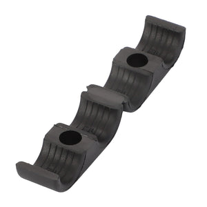 The AGCO Fitting - Acp0672610 is a black plastic cable organizer featuring three curved slots and two mounting holes.