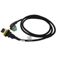 The AGCO Jumper Harness - Acw1390660 is a black automotive electrical cable featuring a connector on one end and a distinctive green and gray plug on the other end, neatly coiled in a loop.