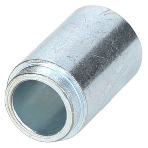 Close-up of the AGCO | SPACER - AL5215227, a cylindrical metal connector with a threaded end and a hollow interior, used for joining pipes or similar components.