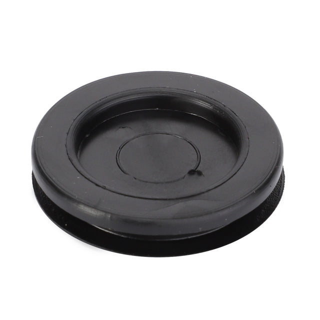 Introducing the AGCO Plug - 4289046M1, a black plastic round cover with a raised outer rim and recessed center, compatible with Massey Ferguson models.