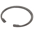 The AGCO | Lock Washer - Fel108551 by AGCO is a metallic retaining ring featuring two small holes near the ends, meticulously designed for securely fastening components on a shaft or within a bore.