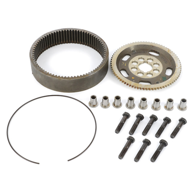 An assortment of mechanical parts, including gears, bolts, cylindrical spacers, and a circular retaining ring—perfect for front axle repair kits—from AGCO's Kit Carrier (Acp0300380), neatly arranged against a white background.