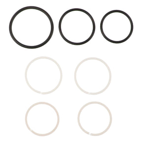 Six rubber O-rings from the AGCO SEAL KIT - AG121390 are arranged in two rows. The top row has three black O-rings in decreasing sizes from left to right, while the bottom row features three white O-rings, identical in size. No available product description information highlights the simplicity and uniformity of this design from AGCO.
