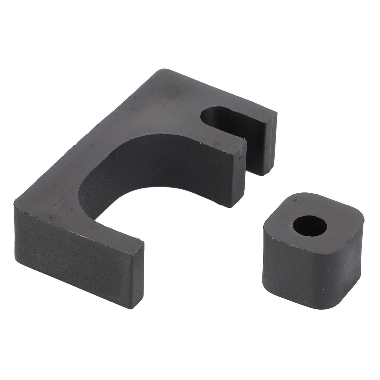 A black, L-shaped bracket with a curved cutout, accompanied by a small square block next to it, both made of metal or plastic and compatible with Massey Ferguson models, named the AGCO Kit Spacer - 3901878M91.