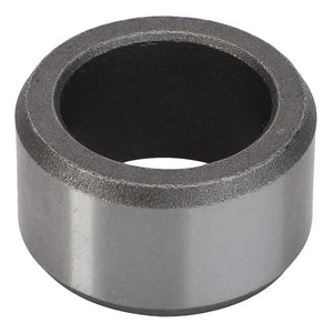 A close-up of the AGCO Bush - F334300020090, a cylindrical, metallic ring object with a smooth outer surface and a dark inner core.