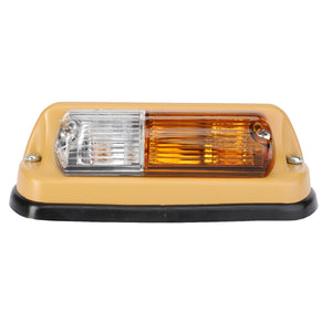 The AGCO Turn Signal Light, with product ID F228900020010, features a rectangular design with a clear lens on the left and an amber lens on the right, mounted on a beige base with rounded edges. Designed for optimum safety and reliability, this versatile light serves as both a headlight and turn signal light on the left side of your vehicle.