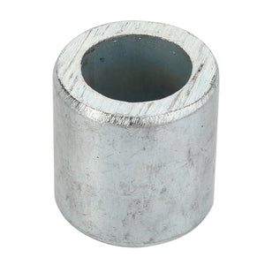 The AGCO Bush - Acp0002930, a cylindrical metal spacer with a hollow center, is often utilized in various mechanical assemblies for precise alignment.