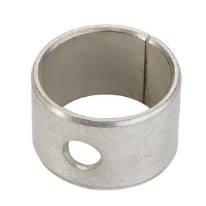 An AGCO Bearing Bushing - F100002238022, featuring a steel ring with a circular hole and a vertical slit, essential for various mechanical or industrial applications.