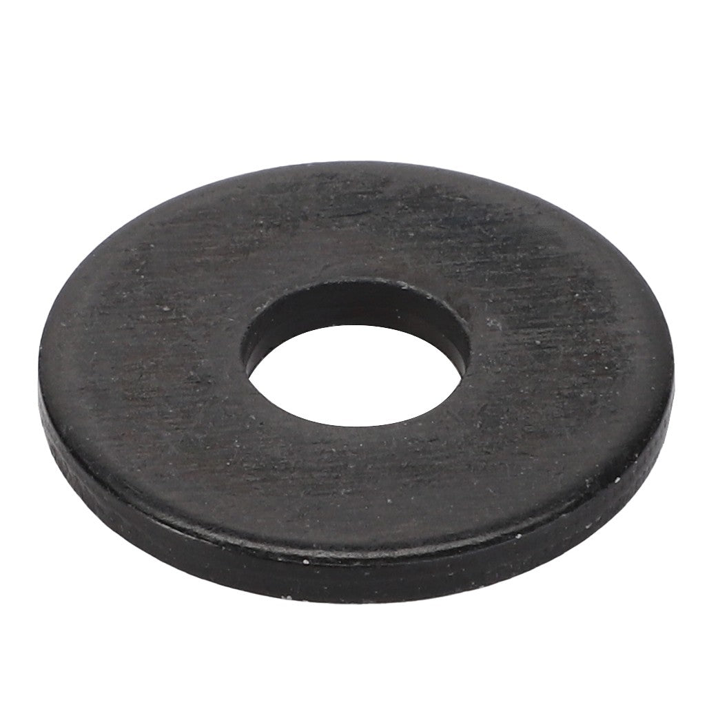 The AGCO | Flat Washer - Acw385071A, a flat, black metal washer with a central circular hole, fits Massey Ferguson models seamlessly.