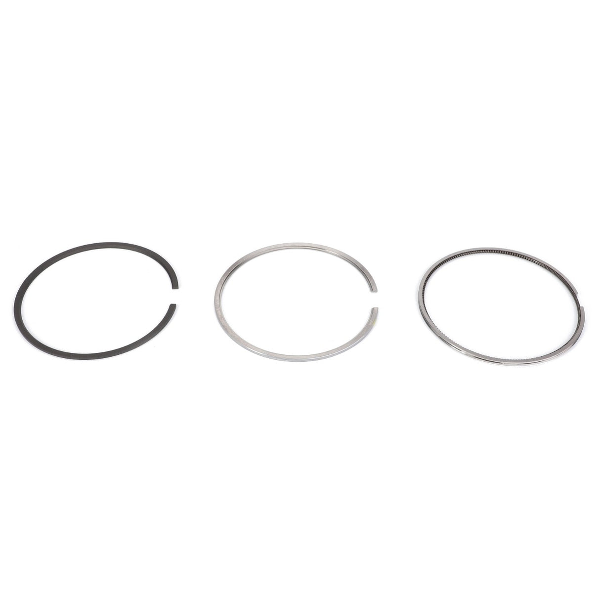 Three piston rings from the AGCO Piston Ring Kit (F339202310170) are displayed on a white background, arranged in a horizontal line. The Genuine AGCO Piston Rings vary in color and texture, ensuring consistent pressure and proper lubrication in your engine.