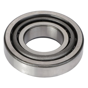 Close-up image of the AGCO Roller Bearing - Acp0360680 highlights its circular outer ring, inner ring, and multiple balls in between. This crucial component from AGCO is used in machinery to reduce friction and support both radial and axial loads.