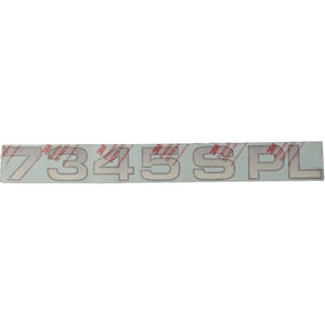 A strip of reflective numbers and letters "7345 SPL" in large print on a protective film, listed under the product name AGCO | Decal - Acw1734540 by the brand AGCO. Unfortunately, no additional current product description information is available.