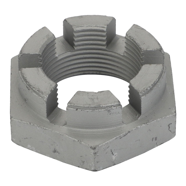 Close-up of an AGCO | Nut - Acw0433070, a metal castellated nut with grooves used in mechanical applications to prevent loosening. The hexagonal-shaped nut features a cylindrical hole in the center. No current product description information available.