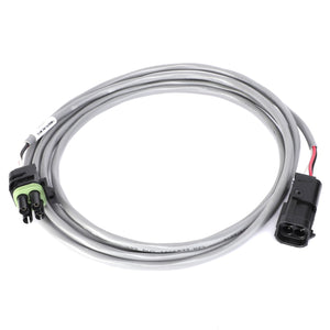 The AGCO EXTENSION - AG334963 is a coiled gray electrical cable featuring connectors on both ends; it has a green and black two-pin connector on one side and a black three-pin connector on the other. Currently, no product description information is available for this item.