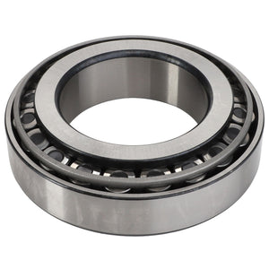 The AGCO BEARING ASSY - D41669400 is a steel cylindrical roller bearing with an inner and outer ring, featuring precisely spaced rollers designed to reduce friction efficiently.