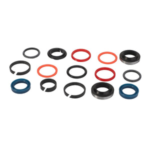 A stunning collection of AGCO's black, red, and blue circular mechanical seals from the GASKET KIT - AL60005579 meticulously arranged on a pristine white background.