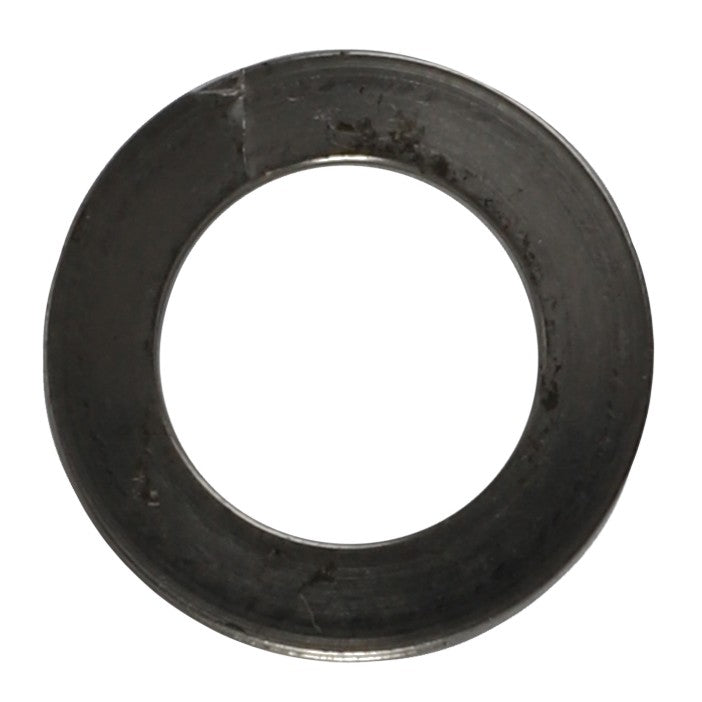 A close-up photo of the AGCO | Washer - 794339, a metal washer from the AGCO brand featuring a central hole and a slightly rough surface with visible smudges and imperfections. No current product description available for this specific item.