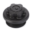 The AGCO Plug - 3800244M91 is a black plastic knob featuring a gear-shaped edge and a droplet symbol on top, designed for use as a cap or plug in machinery or equipment, such as those from Fendt.