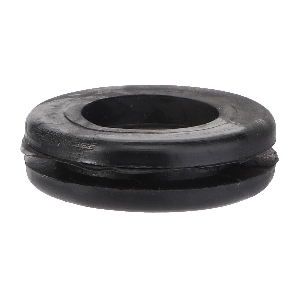 Close-up image of the AGCO Grommet - La10396480 with a central hole and a circular shape, in black rubber. No Product Description Available.