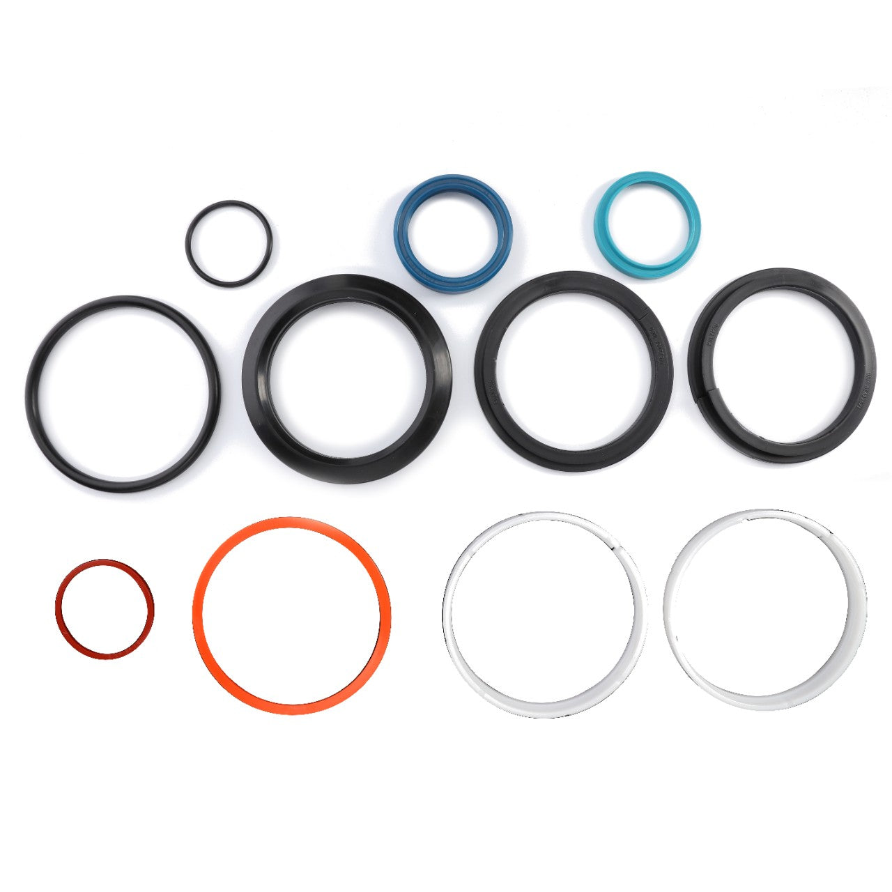 A collection of AGCO Seal Set Hydraulic Cylinder - F931870051090, comprising assorted rubber and plastic O-rings of various colors and sizes, is arranged on a white surface. Current product description information is available upon request.