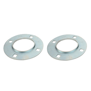 Two AGCO Bearing Flange - Acw1052970 round cast steel flanges with central holes and four square cutouts evenly spaced around the perimeter, placed side by side against a plain white background.