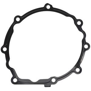 The AGCO Gasket - F530200050410 is a black metal gasket featuring multiple bolt holes arranged around its perimeter.