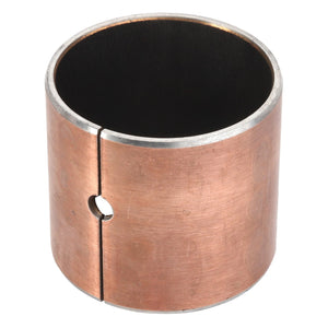 The AGCO Bush - Acp0287020 is a cylindrical metal bushing with a slit and a small circular hole on the side, featuring a copper-colored outer surface and a black inner surface.