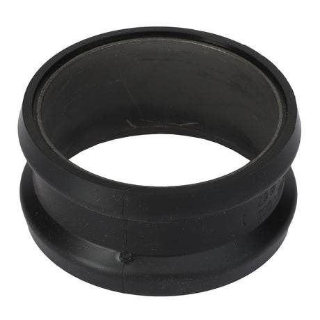 A sleek black cylindrical rubber gasket, identified as AGCO | Plug In Flange - Acp0359630, featuring meticulously grooved edges and a hollow center, is displayed from a slightly angled perspective.