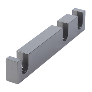 A sleek AGCO metallic gray Spacer - Acw0715410 cable management clip with three slots for neatly organizing wires.