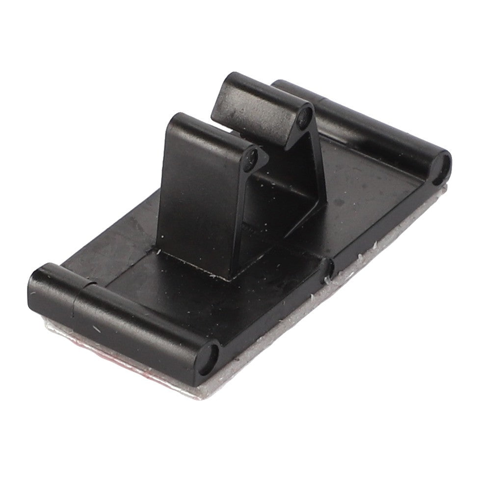 The AGCO MOUNT - V30324000 is a sturdy black plastic mounting bracket that features a flat base and two raised, slotted support arms.