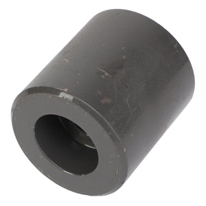 A cylindrical metal object with a hollow center and a slightly rough, dark gray surface that resembles industrial craftsmanship, branded as AGCO and identified by the product name FRONT AXLE - AL10391922.