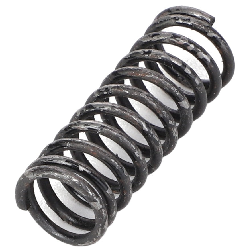 A close-up of the AGCO SPRING - BC2990, a weathered, coiled metal spring manufactured by AGCO, displaying visible wear and rust. No current product description information is available.