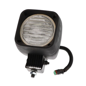 The AGCO WORKLIGHT - AG129822 is a square, black, and silver automotive light featuring a corrugated lens. It is mounted on a bracket and equipped with a coiled wire and connector at the bottom. Unfortunately, no additional product description information is currently available.