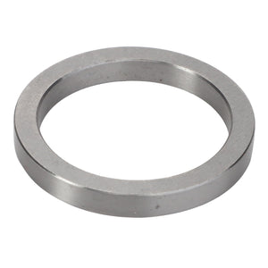 A circular, flat metal washer with a central hole, viewed from an angle against a pristine white background: AGCO | INTERMEDIATE RING - V30386200.