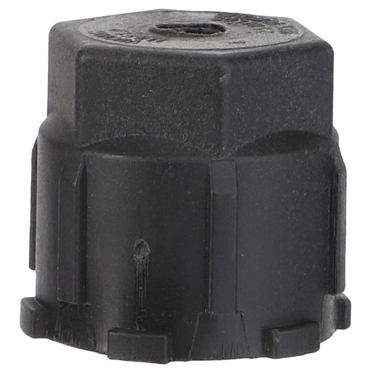 The AGCO | Cap Plug - 72507407 is a black plastic cap with a hexagonal top and cylindrical base, designed to fit perfectly on Massey Ferguson Models.