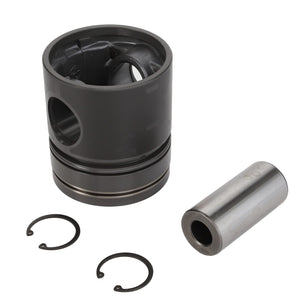 The AGCO Piston - 3639438Z1, showcased on a white background, features a cylindrical and hollow design with grooves. Accompanied by a metallic cylindrical connecting pin and two circlips, this high-quality piston is engineered by AGCO for optimal combustion performance.